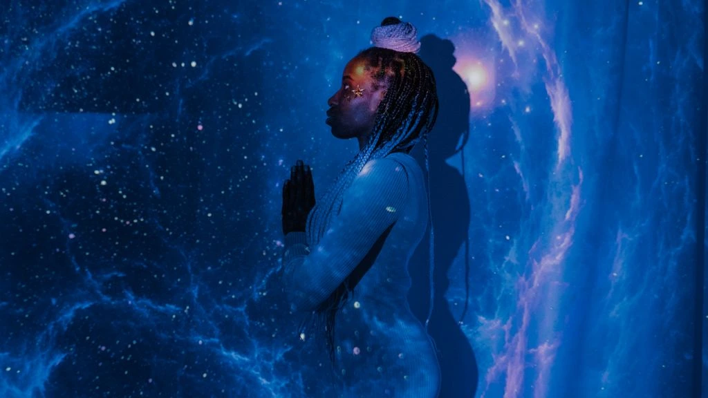 Lena Marchetti, founder of Heaven's Astrolabe, reviewing a natal chart at her desk.